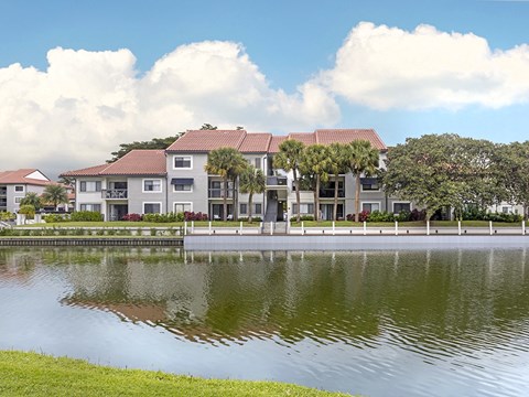 an apartment building overlooking a body of water